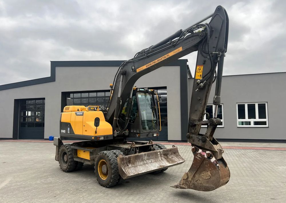 Volvo EW140D - Bager na kotačima: slika Volvo EW140D - Bager na kotačima Volvo EW140D - Bager na kotačima: slika Volvo EW140D - Bager na kotačima