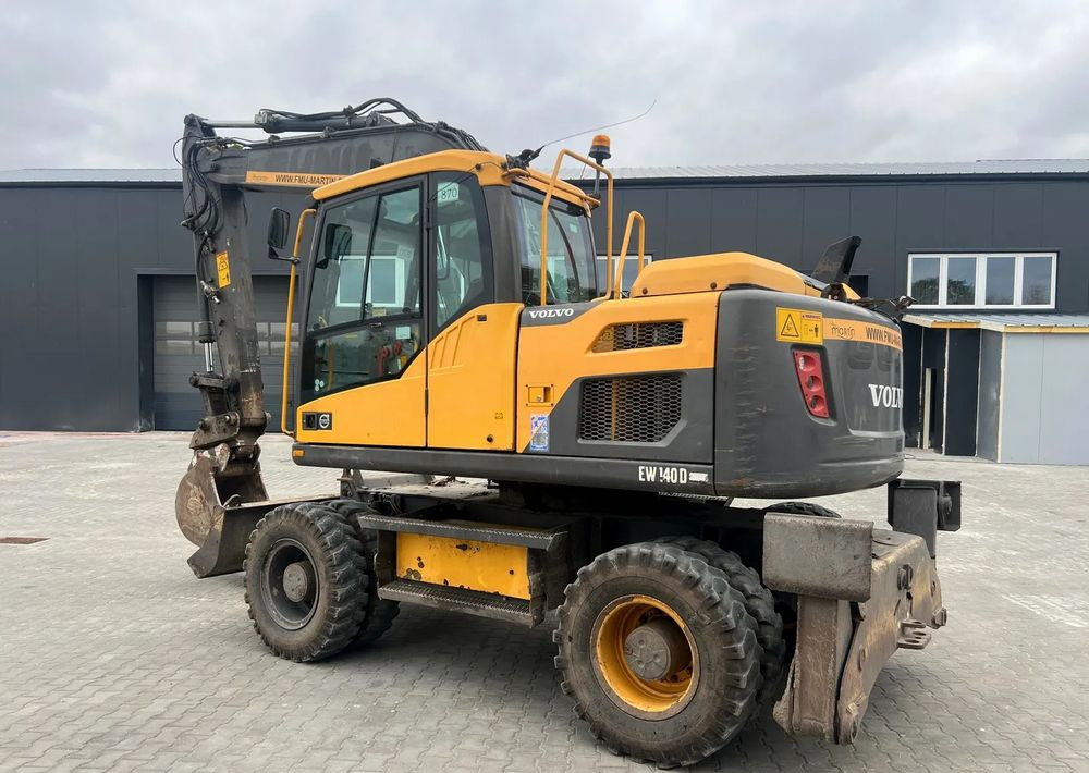 Volvo EW140D - Bager na kotačima: slika Volvo EW140D - Bager na kotačima Volvo EW140D - Bager na kotačima: slika Volvo EW140D - Bager na kotačima