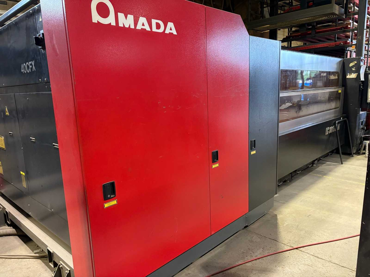 CNC Controlled CO2 Laser Cutting Machine Amada LC 3015 X1 NT - Stroj za obradu metala: slika CNC Controlled CO2 Laser Cutting Machine Amada LC 3015 X1 NT - Stroj za obradu metala CNC Controlled CO2 Laser Cutting Machine Amada LC 3015 X1 NT - Stroj za obradu metala: slika CNC Controlled CO2 Laser Cutting Machine Amada LC 3015 X1 NT - Stroj za obradu metala