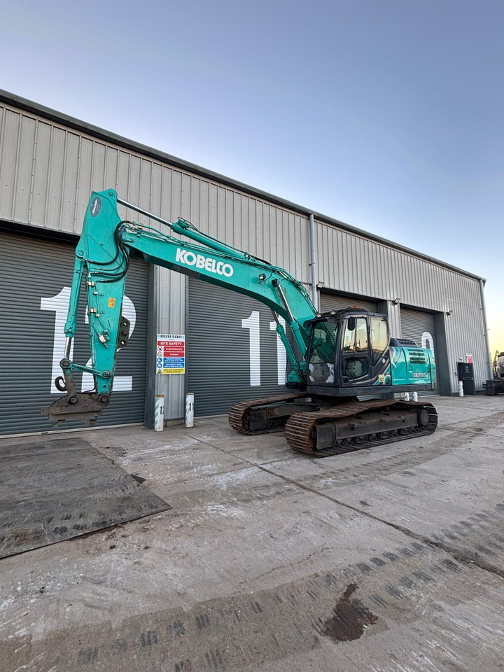 Kobelco SK210LC-10 - Bager gusjeničar: slika Kobelco SK210LC-10 - Bager gusjeničar Kobelco SK210LC-10 - Bager gusjeničar: slika Kobelco SK210LC-10 - Bager gusjeničar