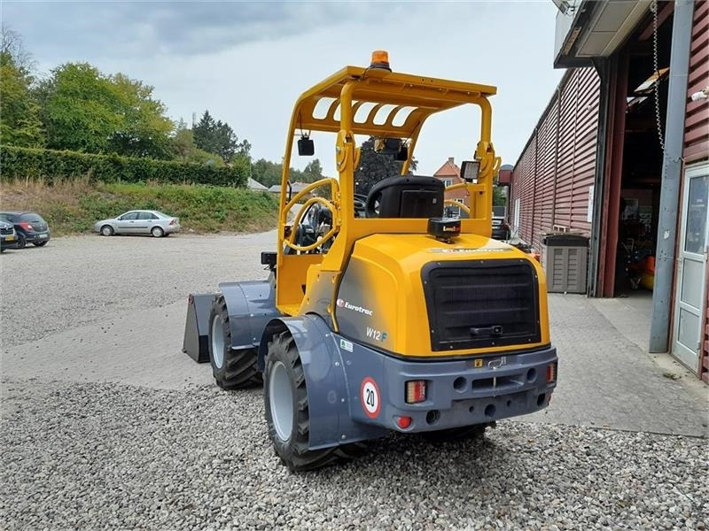 Eurotrac W12 - Zglobni utovarivač: slika Eurotrac W12 - Zglobni utovarivač Eurotrac W12 - Zglobni utovarivač: slika Eurotrac W12 - Zglobni utovarivač