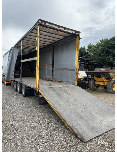 Schmitz Cargobull Machine transport trailer with bag ramp - Poluprikolica s niskim utovarivačem: slika Schmitz Cargobull Machine transport trailer with bag ramp - Poluprikolica s niskim utovarivačem Schmitz Cargobull Machine transport trailer with bag ramp - Poluprikolica s niskim utovarivačem: slika Schmitz Cargobull Machine transport trailer with bag ramp - Poluprikolica s niskim utovarivačem
