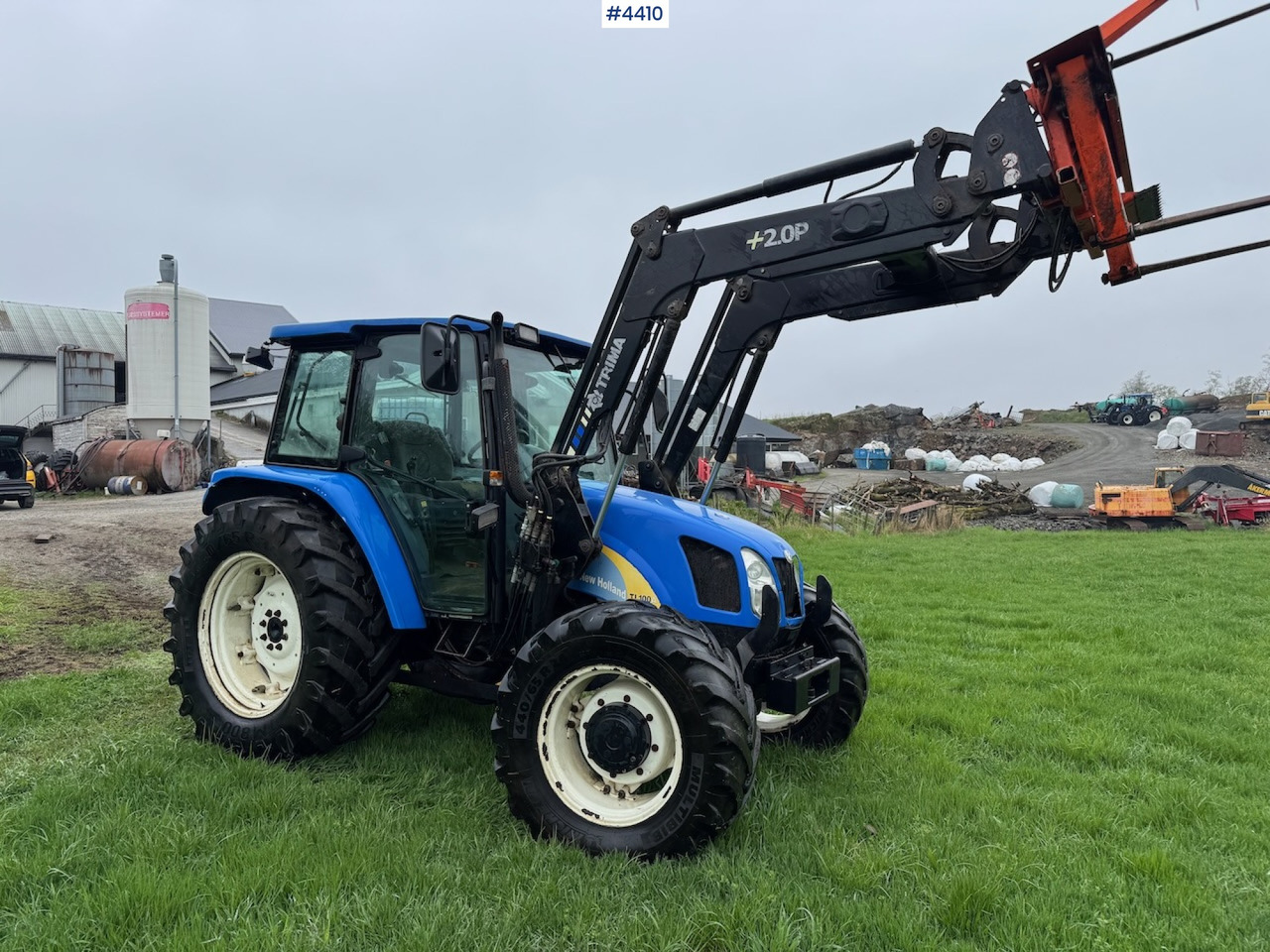 2006 New Holland TL100 A w/Front Loader. - Traktor: slika 2006 New Holland TL100 A w/Front Loader. - Traktor 2006 New Holland TL100 A w/Front Loader. - Traktor: slika 2006 New Holland TL100 A w/Front Loader. - Traktor