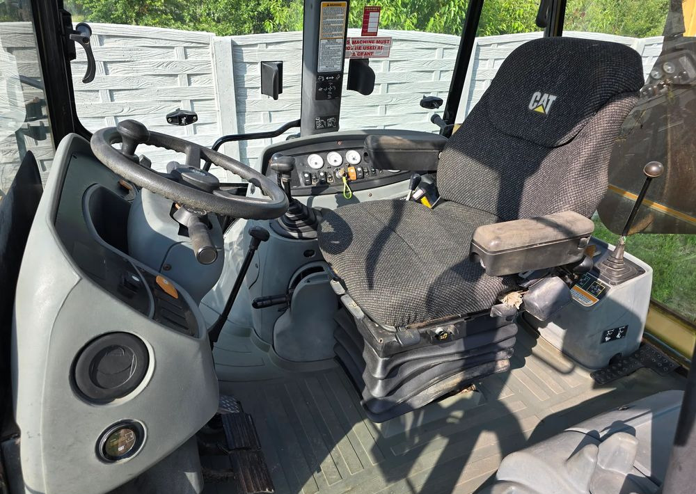 Caterpillar - Rovokopač-utovarivač: slika Caterpillar - Rovokopač-utovarivač Caterpillar - Rovokopač-utovarivač: slika Caterpillar - Rovokopač-utovarivač
