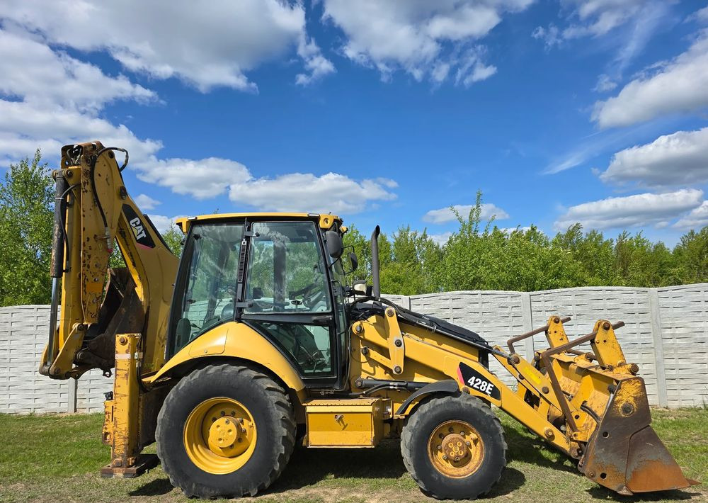 Caterpillar - Rovokopač-utovarivač: slika  Caterpillar - Rovokopač-utovarivač Caterpillar - Rovokopač-utovarivač: slika  Caterpillar - Rovokopač-utovarivač