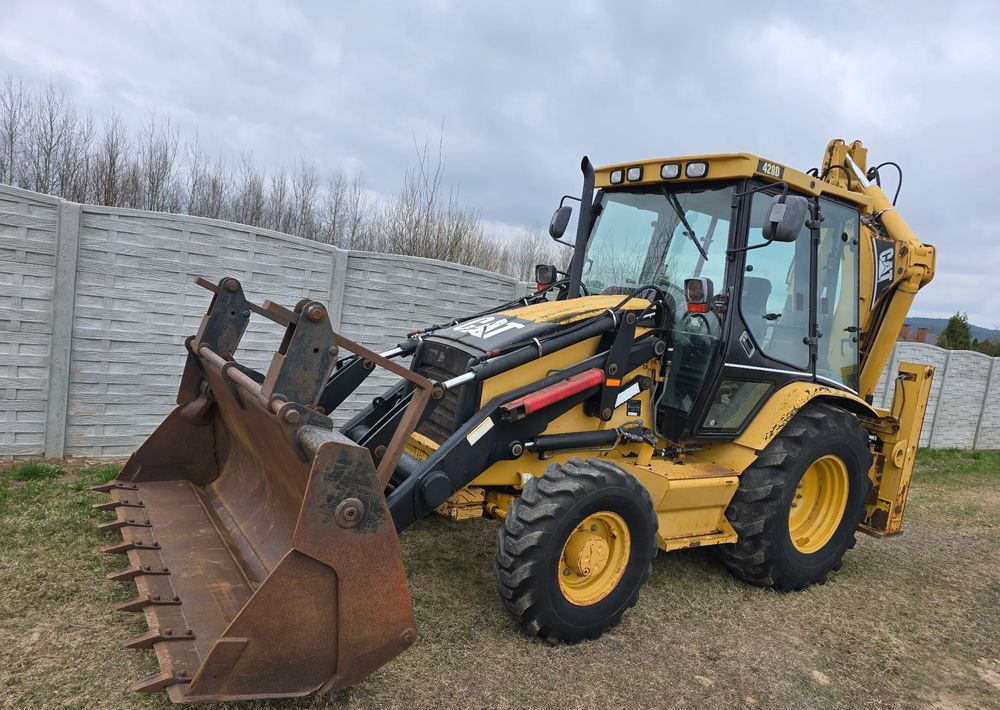 Caterpillar - Rovokopač-utovarivač: slika Caterpillar - Rovokopač-utovarivač Caterpillar - Rovokopač-utovarivač: slika Caterpillar - Rovokopač-utovarivač