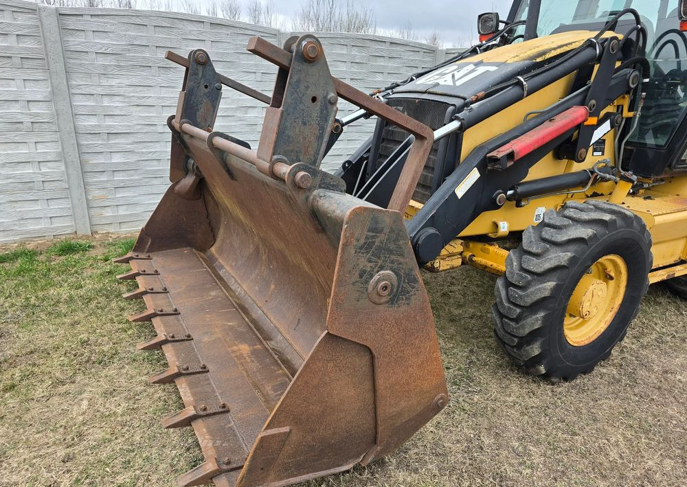 Caterpillar - Rovokopač-utovarivač: slika Caterpillar - Rovokopač-utovarivač Caterpillar - Rovokopač-utovarivač: slika Caterpillar - Rovokopač-utovarivač