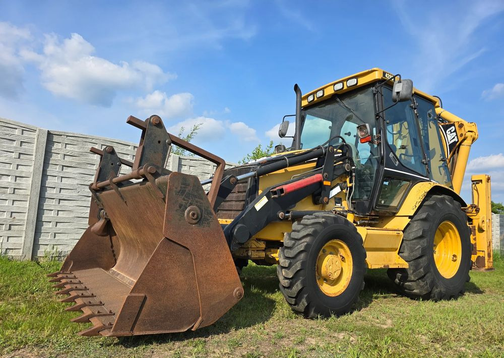 Caterpillar - Rovokopač-utovarivač: slika Caterpillar - Rovokopač-utovarivač Caterpillar - Rovokopač-utovarivač: slika Caterpillar - Rovokopač-utovarivač