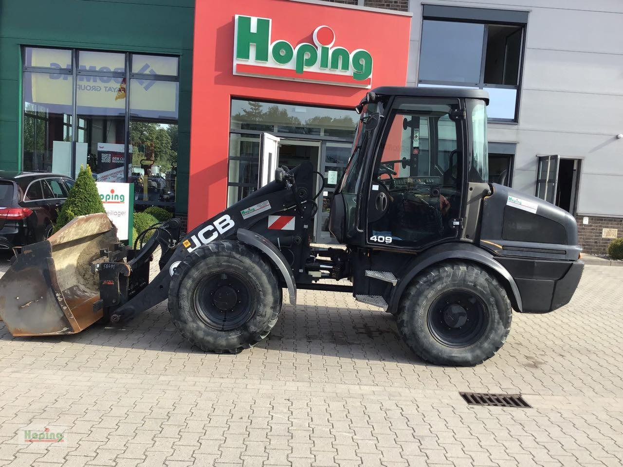 JCB 409 - Utovarivač na kotačima: slika JCB 409 - Utovarivač na kotačima JCB 409 - Utovarivač na kotačima: slika JCB 409 - Utovarivač na kotačima