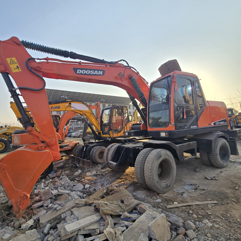 Doosan DX150W-9C - Bager na kotačima: slika Doosan DX150W-9C - Bager na kotačima Doosan DX150W-9C - Bager na kotačima: slika Doosan DX150W-9C - Bager na kotačima