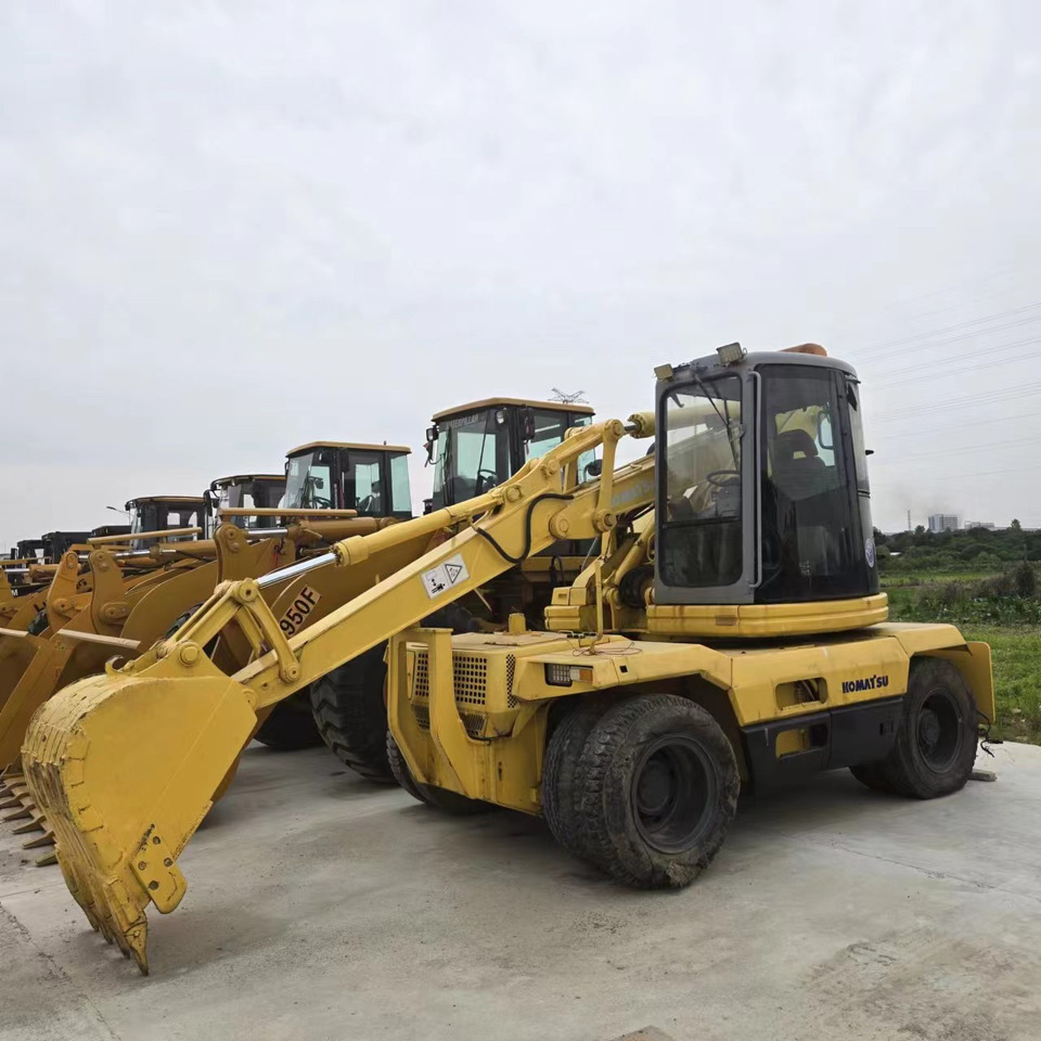 KOMATSU PC128US - Bager na kotačima: slika KOMATSU PC128US - Bager na kotačima KOMATSU PC128US - Bager na kotačima: slika KOMATSU PC128US - Bager na kotačima