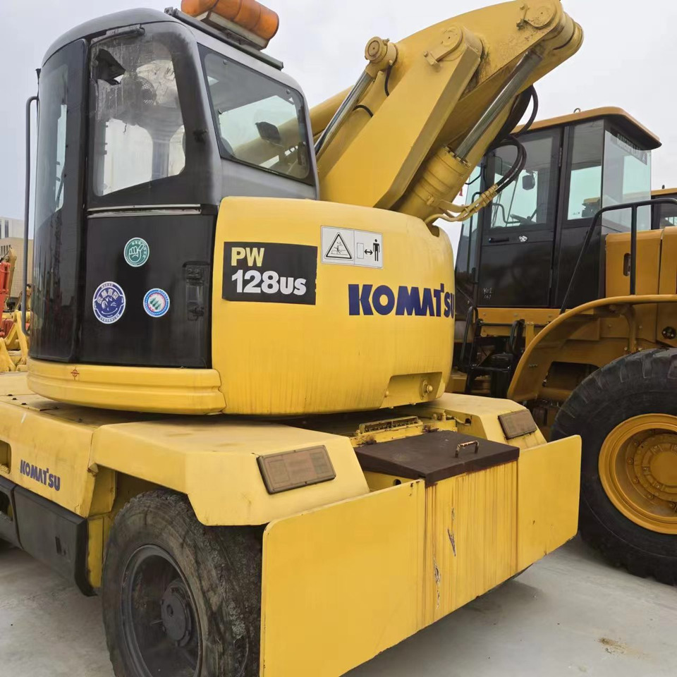 KOMATSU PC128US - Bager na kotačima: slika KOMATSU PC128US - Bager na kotačima KOMATSU PC128US - Bager na kotačima: slika KOMATSU PC128US - Bager na kotačima
