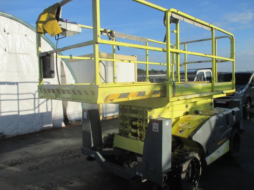 Haulotte Compact 12 DX - Škarasta podizna platforma: slika Haulotte Compact 12 DX - Škarasta podizna platforma Haulotte Compact 12 DX - Škarasta podizna platforma: slika Haulotte Compact 12 DX - Škarasta podizna platforma