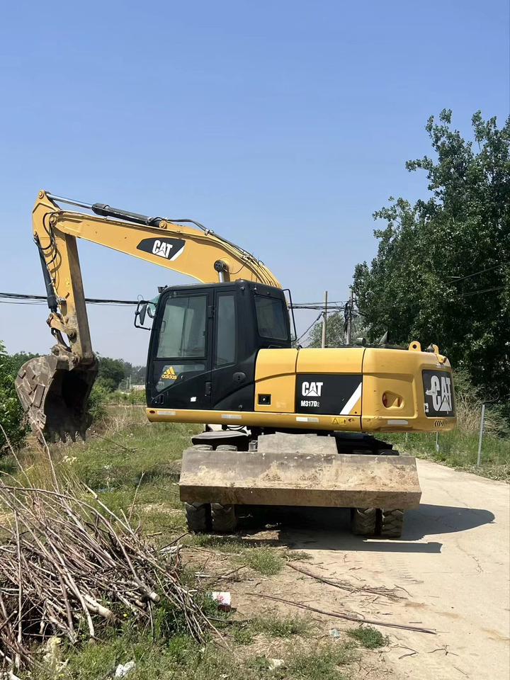 CATERPILLAR M317D2 - Bager na kotačima: slika CATERPILLAR M317D2 - Bager na kotačima CATERPILLAR M317D2 - Bager na kotačima: slika CATERPILLAR M317D2 - Bager na kotačima