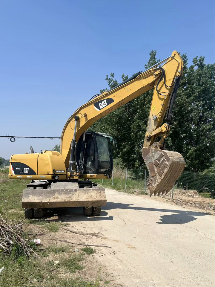 CATERPILLAR M317D2 - Bager na kotačima: slika CATERPILLAR M317D2 - Bager na kotačima CATERPILLAR M317D2 - Bager na kotačima: slika CATERPILLAR M317D2 - Bager na kotačima