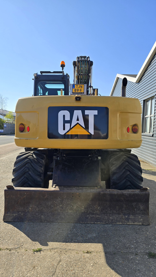 Bager na kotačima CATERPILLAR M313D: slika Bager na kotačima CATERPILLAR M313D