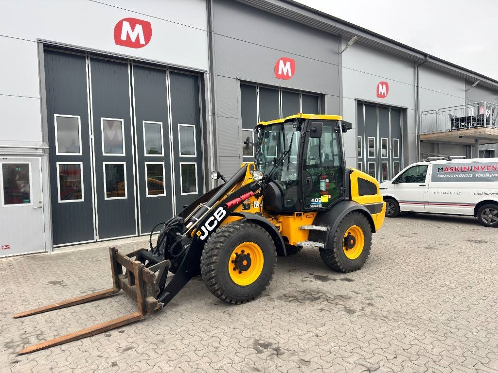 JCB 409 - Utovarivač na kotačima: slika JCB 409 - Utovarivač na kotačima JCB 409 - Utovarivač na kotačima: slika JCB 409 - Utovarivač na kotačima