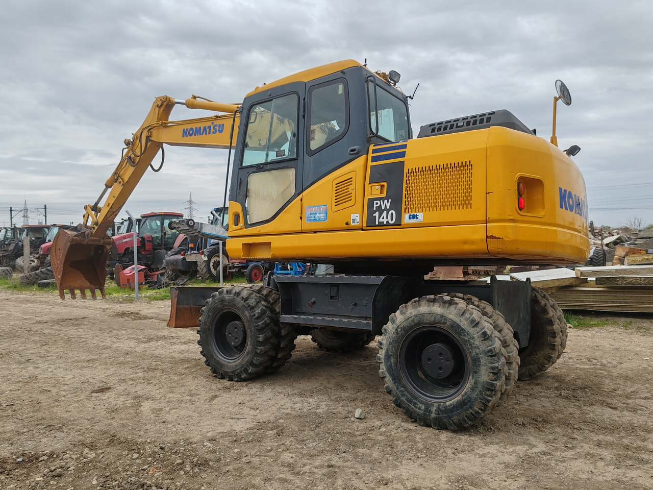 Komatsu PW140-7 - Bager na kotačima: slika Komatsu PW140-7 - Bager na kotačima Komatsu PW140-7 - Bager na kotačima: slika Komatsu PW140-7 - Bager na kotačima