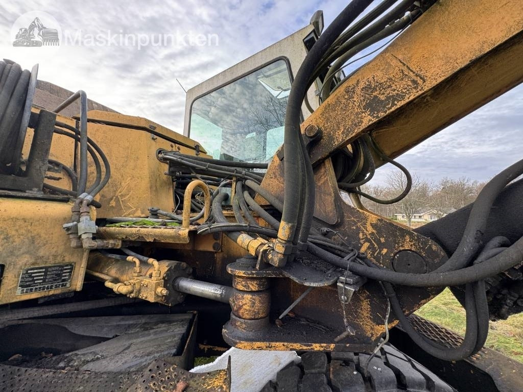Bager na kotačima Liebherr A 310 B: slika Bager na kotačima Liebherr A 310 B Bager na kotačima Liebherr A 310 B: slika Bager na kotačima Liebherr A 310 B