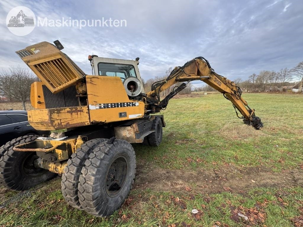 Liebherr A 310 B - Bager na kotačima: slika Liebherr A 310 B - Bager na kotačima Liebherr A 310 B - Bager na kotačima: slika Liebherr A 310 B - Bager na kotačima
