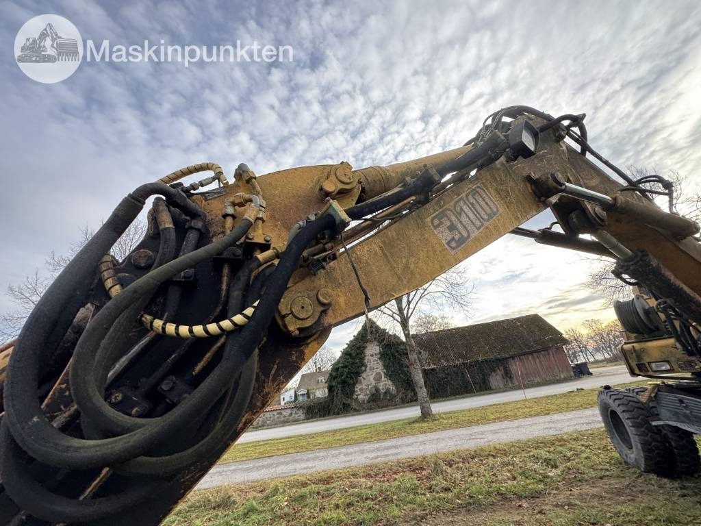 Bager na kotačima Liebherr A 310 B: slika Bager na kotačima Liebherr A 310 B Bager na kotačima Liebherr A 310 B: slika Bager na kotačima Liebherr A 310 B