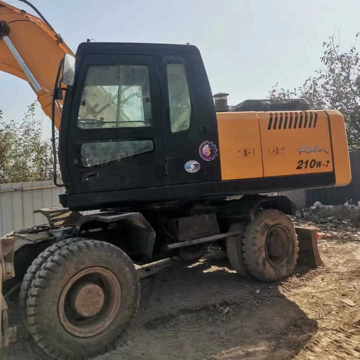 Yellow Color Hyundai210w-7 Used Wheel Excavator Used Hyundai210-7 on Sale with Cheap Price - Bager na kotačima: slika Yellow Color Hyundai210w-7 Used Wheel Excavator Used Hyundai210-7 on Sale with Cheap Price - Bager na kotačima Yellow Color Hyundai210w-7 Used Wheel Excavator Used Hyundai210-7 on Sale with Cheap Price - Bager na kotačima: slika Yellow Color Hyundai210w-7 Used Wheel Excavator Used Hyundai210-7 on Sale with Cheap Price - Bager na kotačima