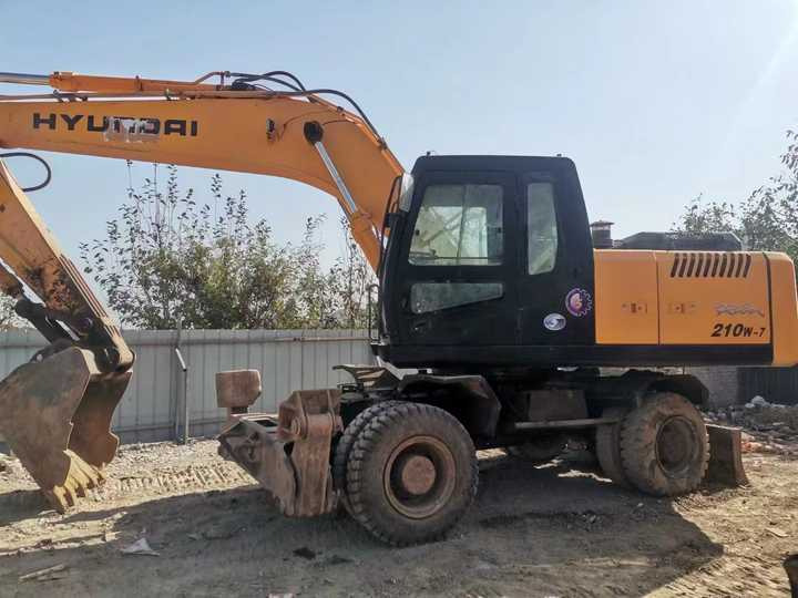 Yellow Color Hyundai210w-7 Used Wheel Excavator Used Hyundai210-7 on Sale with Cheap Price - Bager gusjeničar: slika Yellow Color Hyundai210w-7 Used Wheel Excavator Used Hyundai210-7 on Sale with Cheap Price - Bager gusjeničar Yellow Color Hyundai210w-7 Used Wheel Excavator Used Hyundai210-7 on Sale with Cheap Price - Bager gusjeničar: slika Yellow Color Hyundai210w-7 Used Wheel Excavator Used Hyundai210-7 on Sale with Cheap Price - Bager gusjeničar