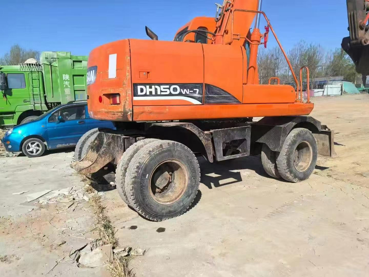 DOOSAN DH150W-7 - Bager na kotačima: slika DOOSAN DH150W-7 - Bager na kotačima DOOSAN DH150W-7 - Bager na kotačima: slika DOOSAN DH150W-7 - Bager na kotačima