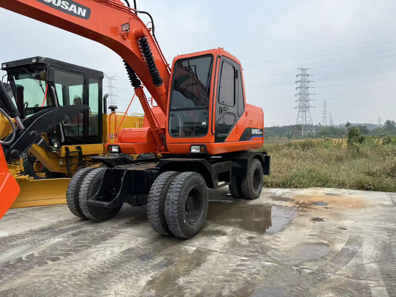 DOOSAN DH150W-7 - Bager na kotačima: slika DOOSAN DH150W-7 - Bager na kotačima DOOSAN DH150W-7 - Bager na kotačima: slika DOOSAN DH150W-7 - Bager na kotačima