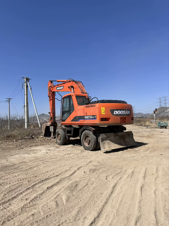 DOOSAN DH210W-7 - Bager na kotačima: slika DOOSAN DH210W-7 - Bager na kotačima DOOSAN DH210W-7 - Bager na kotačima: slika DOOSAN DH210W-7 - Bager na kotačima