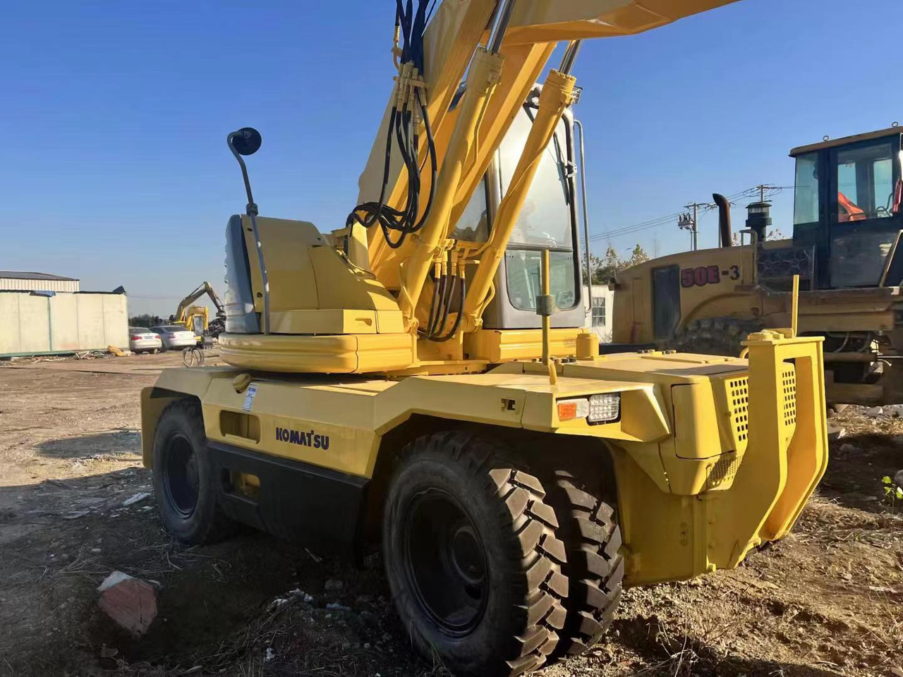 KOMATSU PC128US - Bager na kotačima: slika KOMATSU PC128US - Bager na kotačima KOMATSU PC128US - Bager na kotačima: slika KOMATSU PC128US - Bager na kotačima