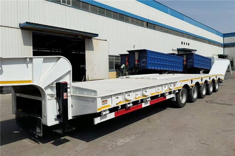 TITAN 5 Axle 100 Ton Low Bed Trailer for Sale In Tanzania - Poluprikolica s niskim utovarivačem: slika TITAN 5 Axle 100 Ton Low Bed Trailer for Sale In Tanzania - Poluprikolica s niskim utovarivačem TITAN 5 Axle 100 Ton Low Bed Trailer for Sale In Tanzania - Poluprikolica s niskim utovarivačem: slika TITAN 5 Axle 100 Ton Low Bed Trailer for Sale In Tanzania - Poluprikolica s niskim utovarivačem