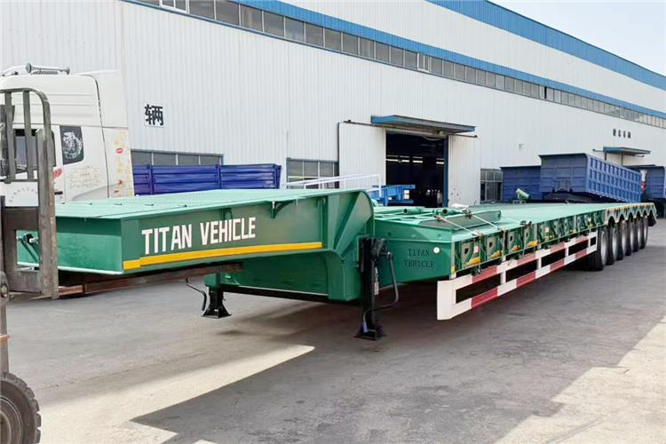 TITAN 6 Axle 80 Ton Low Loader Semi Trailer for Sale In Zambia - Poluprikolica s niskim utovarivačem: slika TITAN 6 Axle 80 Ton Low Loader Semi Trailer for Sale In Zambia - Poluprikolica s niskim utovarivačem TITAN 6 Axle 80 Ton Low Loader Semi Trailer for Sale In Zambia - Poluprikolica s niskim utovarivačem: slika TITAN 6 Axle 80 Ton Low Loader Semi Trailer for Sale In Zambia - Poluprikolica s niskim utovarivačem