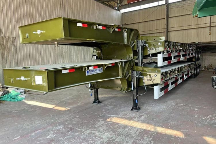 Novi Poluprikolica s niskim utovarivačem za prijevoz teških strojeva TITAN Low Bed Trailer Truck for Sale in Zambia: slika Novi Poluprikolica s niskim utovarivačem za prijevoz teških strojeva TITAN Low Bed Trailer Truck for Sale in Zambia