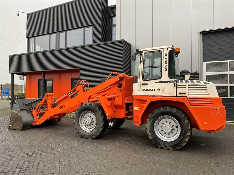 Schaeff SKL863 High-Lift Special - Utovarivač na kotačima: slika Schaeff SKL863 High-Lift Special - Utovarivač na kotačima Schaeff SKL863 High-Lift Special - Utovarivač na kotačima: slika Schaeff SKL863 High-Lift Special - Utovarivač na kotačima