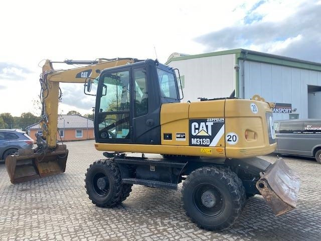 Cat M 313 D MIETE / RENTAL (12005587) - Bager na kotačima: slika Cat M 313 D MIETE / RENTAL (12005587) - Bager na kotačima Cat M 313 D MIETE / RENTAL (12005587) - Bager na kotačima: slika Cat M 313 D MIETE / RENTAL (12005587) - Bager na kotačima