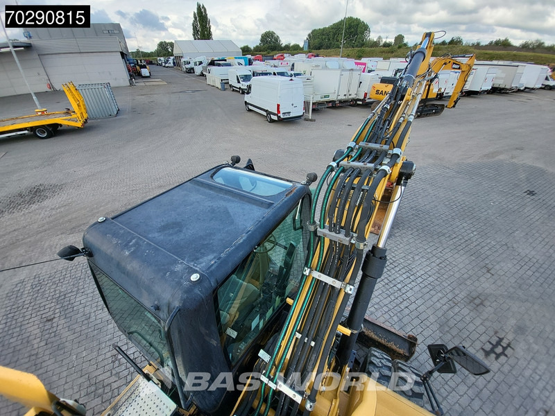 Bager na kotačima Caterpillar M313 D: slika Bager na kotačima Caterpillar M313 D