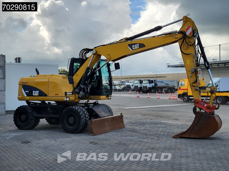 Bager na kotačima Caterpillar M313 D: slika Bager na kotačima Caterpillar M313 D