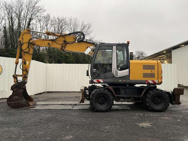 Hitachi ZX140W-3 - Bager na kotačima: slika Hitachi ZX140W-3 - Bager na kotačima Hitachi ZX140W-3 - Bager na kotačima: slika Hitachi ZX140W-3 - Bager na kotačima