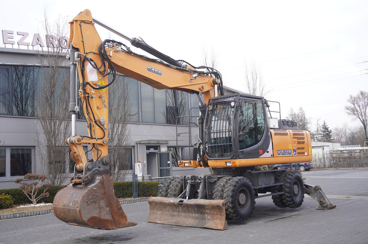 CASE WX218 / 23t wheeled excavator / 3 times folding arm - Bager na kotačima: slika CASE WX218 / 23t wheeled excavator / 3 times folding arm - Bager na kotačima CASE WX218 / 23t wheeled excavator / 3 times folding arm - Bager na kotačima: slika CASE WX218 / 23t wheeled excavator / 3 times folding arm - Bager na kotačima