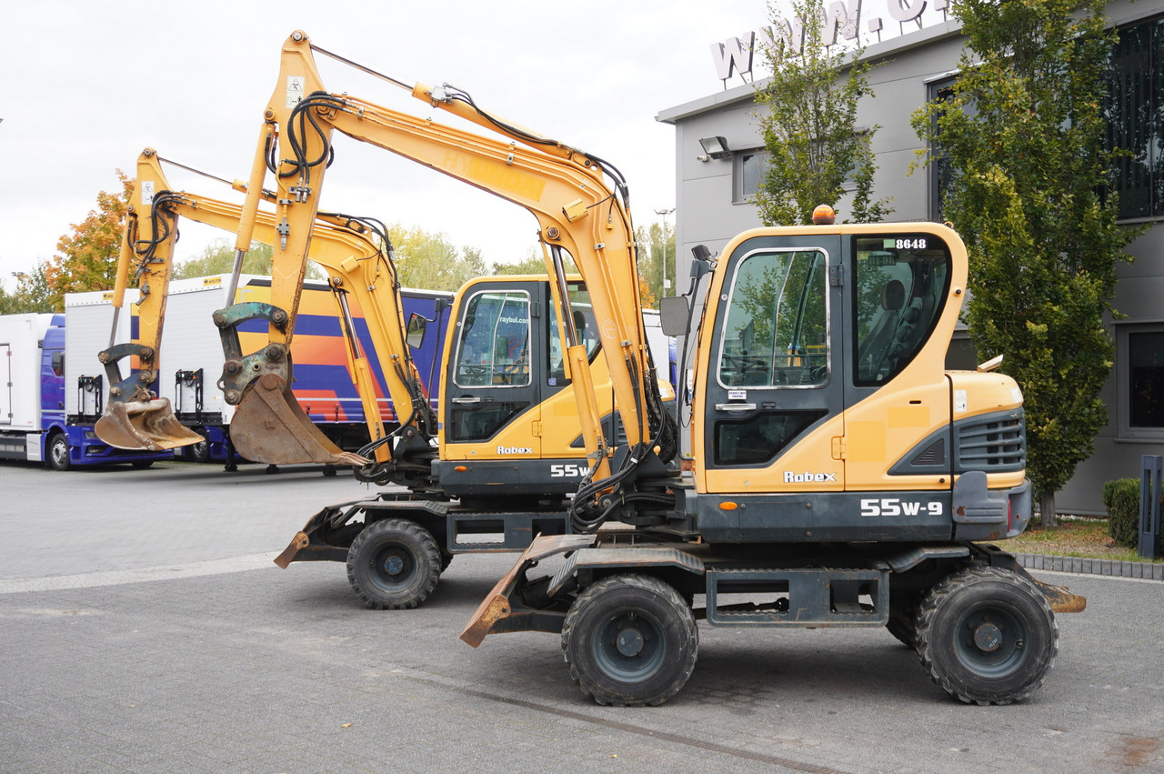 Hyundai Robex 55W-9 Wheeled Excavator 5.5t / 2 units - Bager na kotačima: slika Hyundai Robex 55W-9 Wheeled Excavator 5.5t / 2 units - Bager na kotačima Hyundai Robex 55W-9 Wheeled Excavator 5.5t / 2 units - Bager na kotačima: slika Hyundai Robex 55W-9 Wheeled Excavator 5.5t / 2 units - Bager na kotačima