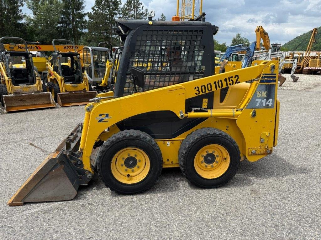 Komatsu SK714-5 (4026) - Mini utovarivač: slika Komatsu SK714-5 (4026) - Mini utovarivač Komatsu SK714-5 (4026) - Mini utovarivač: slika Komatsu SK714-5 (4026) - Mini utovarivač