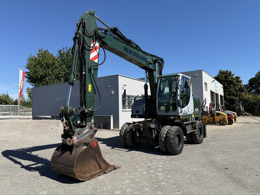 New Holland MH-Plus (111695) - Bager na kotačima: slika New Holland MH-Plus (111695) - Bager na kotačima New Holland MH-Plus (111695) - Bager na kotačima: slika New Holland MH-Plus (111695) - Bager na kotačima