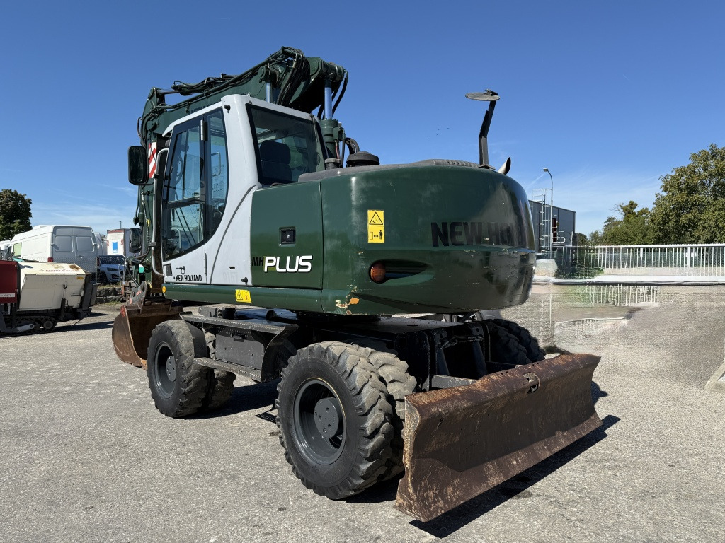New Holland MH-Plus (111695) - Bager na kotačima: slika New Holland MH-Plus (111695) - Bager na kotačima New Holland MH-Plus (111695) - Bager na kotačima: slika New Holland MH-Plus (111695) - Bager na kotačima
