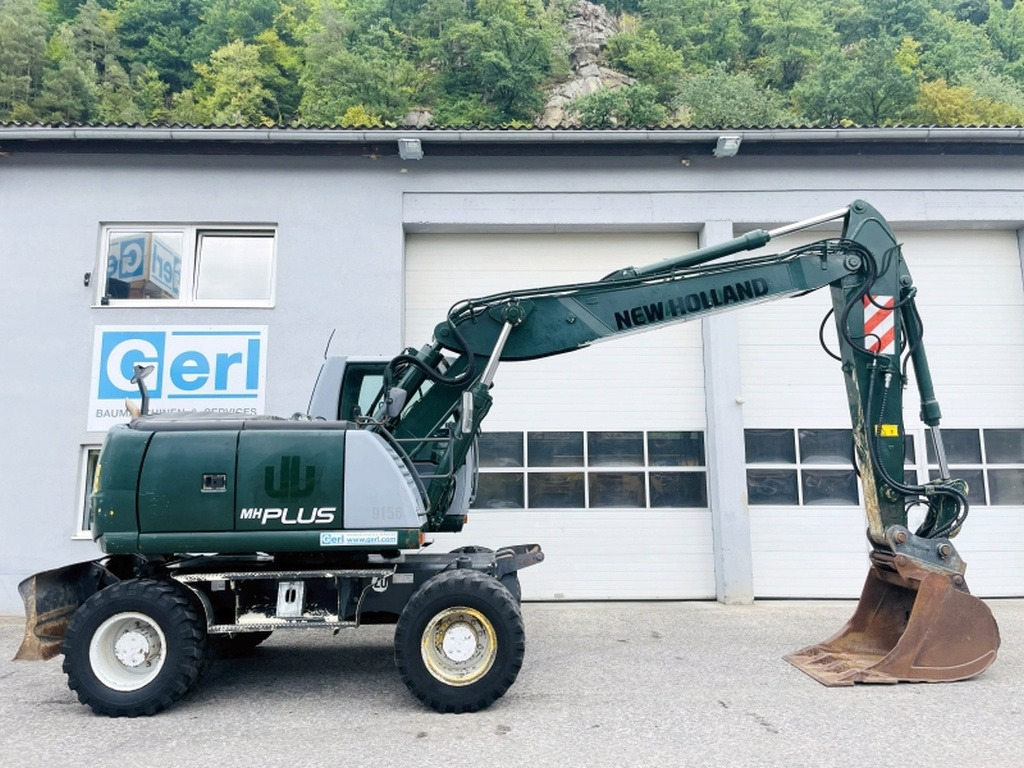 New Holland MH Plus (4054) - Bager na kotačima: slika New Holland MH Plus (4054) - Bager na kotačima New Holland MH Plus (4054) - Bager na kotačima: slika New Holland MH Plus (4054) - Bager na kotačima