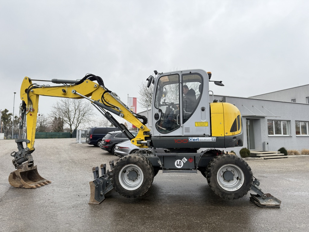 Wacker Neuson EW 100 (111768) - Bager na kotačima: slika Wacker Neuson EW 100 (111768) - Bager na kotačima Wacker Neuson EW 100 (111768) - Bager na kotačima: slika Wacker Neuson EW 100 (111768) - Bager na kotačima