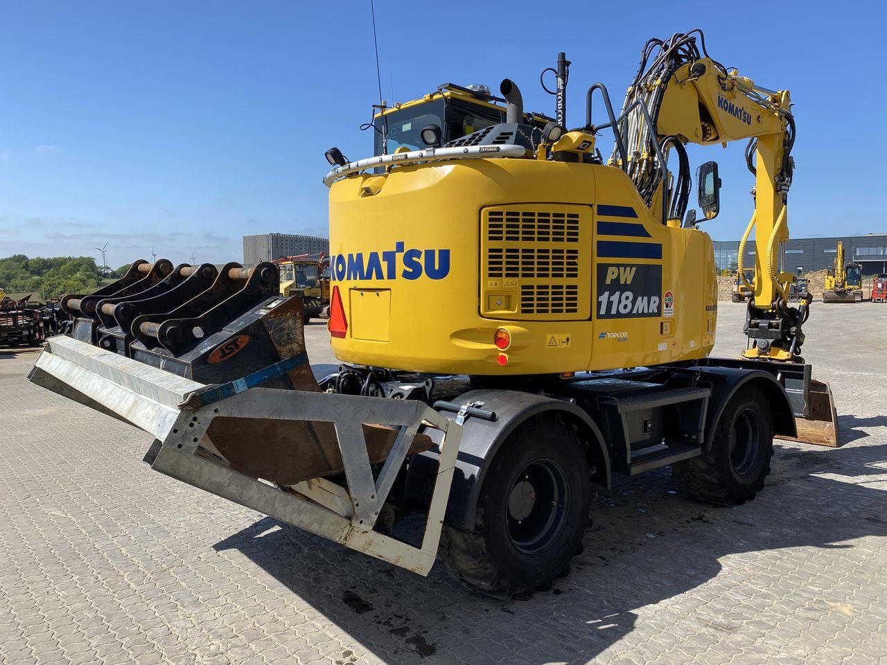 Komatsu PW118MR-11 - Bager na kotačima: slika Komatsu PW118MR-11 - Bager na kotačima Komatsu PW118MR-11 - Bager na kotačima: slika Komatsu PW118MR-11 - Bager na kotačima