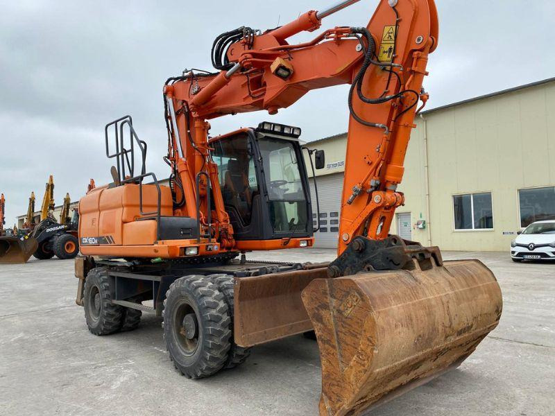 Doosan DX160 - Bager na kotačima: slika Doosan DX160 - Bager na kotačima Doosan DX160 - Bager na kotačima: slika Doosan DX160 - Bager na kotačima
