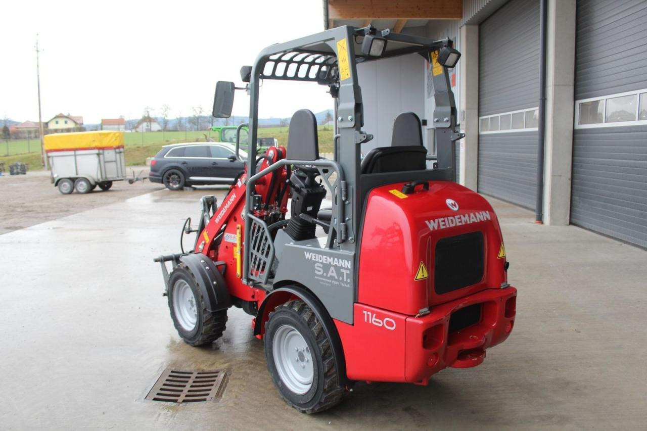 Weidemann 1160-11 stunden - Mini bager: slika Weidemann 1160-11 stunden - Mini bager Weidemann 1160-11 stunden - Mini bager: slika Weidemann 1160-11 stunden - Mini bager