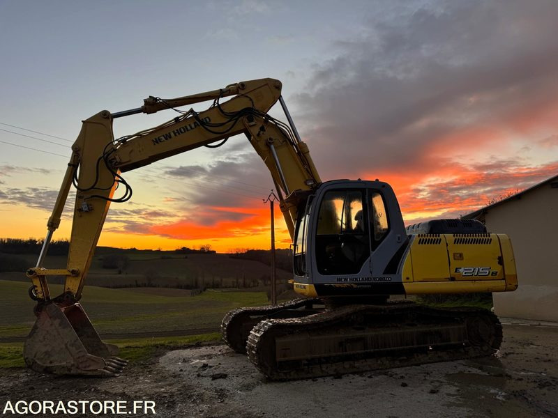 PELLE NEW HOLLAND E215B - 2009 - 11000 heures - Bager: slika PELLE NEW HOLLAND E215B - 2009 - 11000 heures - Bager PELLE NEW HOLLAND E215B - 2009 - 11000 heures - Bager: slika PELLE NEW HOLLAND E215B - 2009 - 11000 heures - Bager